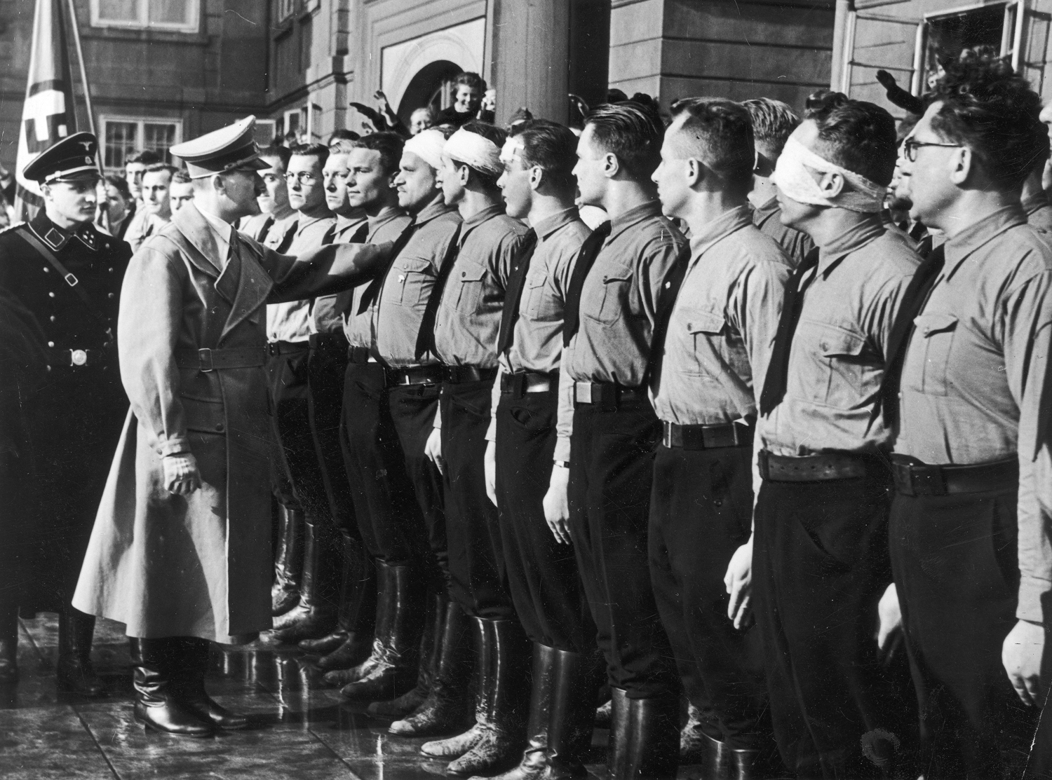 Adolf Hitler in Hradschin's quarter in Prague greets some German wounded soldiers